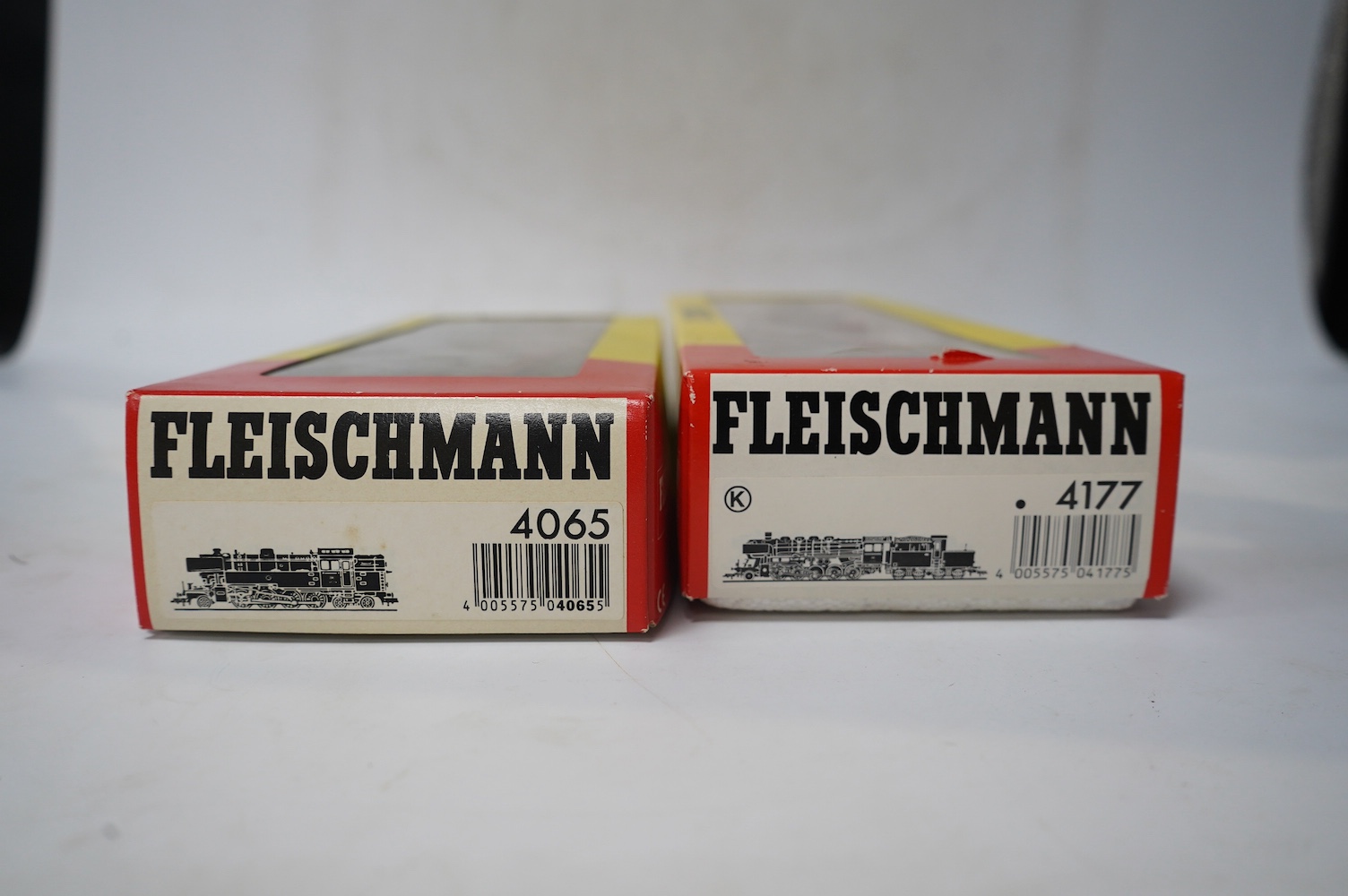 Two boxed Fleischmann HO gauge railway German DB locomotives; a 2-10-0 loco, 50 493, (4177), and a 2-8-4T loco, 65 018, (4065), together with a quantity of useful Fleischmann ballasted track sections, including double po